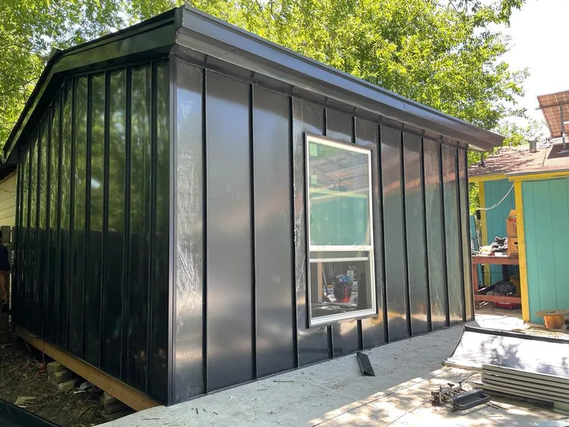 Black standing seam metal wall panels for Metal Roof Installation in Perry